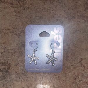 Zara Larson Claire's silver Starfish earrings